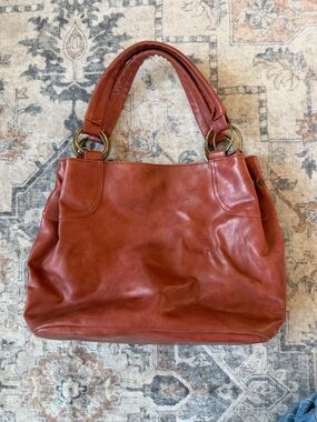 Aldo Brown Leather Handbag with Brass Ring Accents